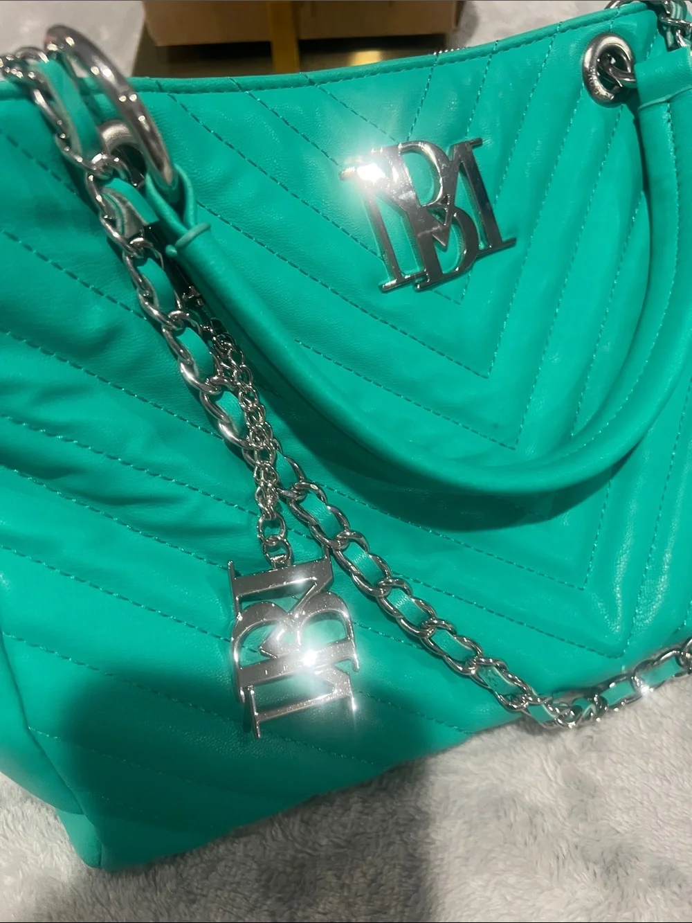 Badgley Mischka Chevron Quilted Shoulder Bag in a vibrant teal/mint green hue.